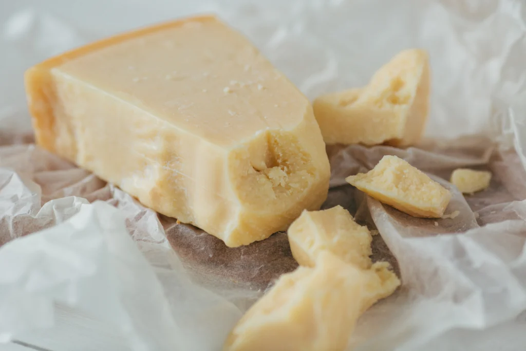 Parmigiano Reggiano, a hard cheese from the Emilia-Romagna region of Italy.
